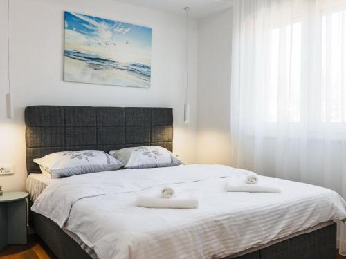 En eller flere senge i et værelse på Apartment Con Amore