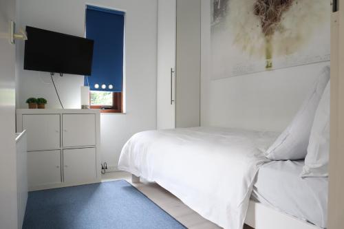 Postel nebo postele na pokoji v ubytování Meerpaal, Spaanse Galeien 65 Cadzand