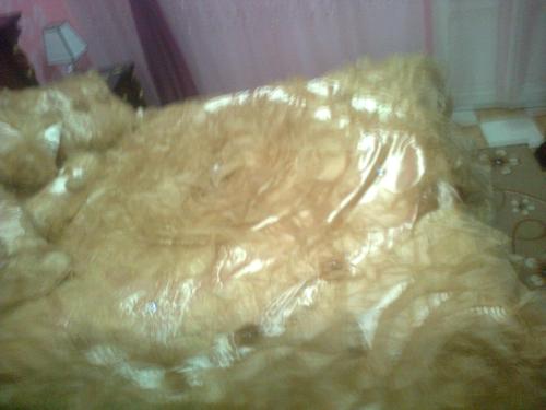 a close up of a blanket on a bed at Tabrany in Qaryat Abū Bakr aş Şiddīq