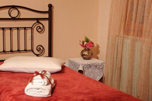 Ένα ή περισσότερα κρεβάτια σε δωμάτιο στο Chrysoula's Guests
