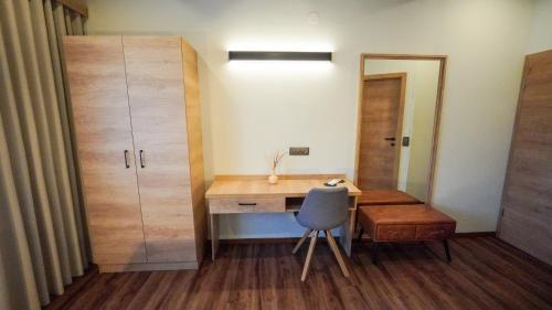 a small room with a desk and a chair at Hiša na Hribu- A Peaceful Hilltop Escape above river Kolpa in Kostel