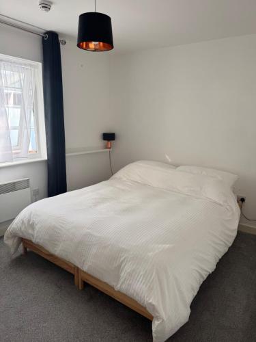 Ένα ή περισσότερα κρεβάτια σε δωμάτιο στο Room in central Leeds apartment