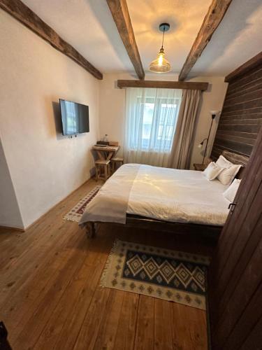 Casa de Oaspeti Caezuにあるベッド