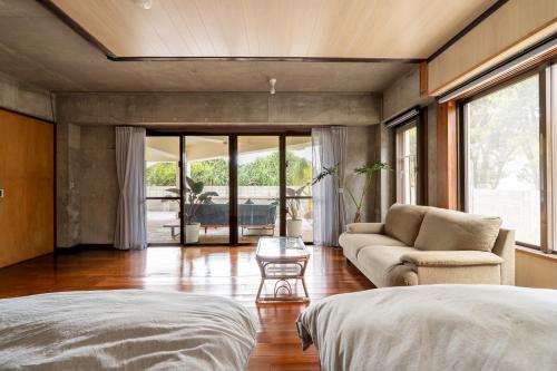 Ένα ή περισσότερα κρεβάτια σε δωμάτιο στο Alumina アルミナ