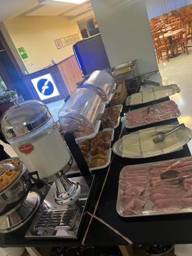 a buffet with different types of food on a table at Hotel Albatros in Mestre