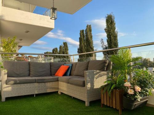 a couch on the balcony of a house at Gorgeous 1 Bedroom apartment close to Town Centre in Limassol