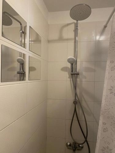 a bathroom with a shower with a shower head at Gorgeous 1 Bedroom apartment close to Town Centre in Limassol