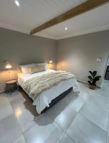 a bedroom with a large bed in a room at Ideal Location Kimberley 4 in Kimberley