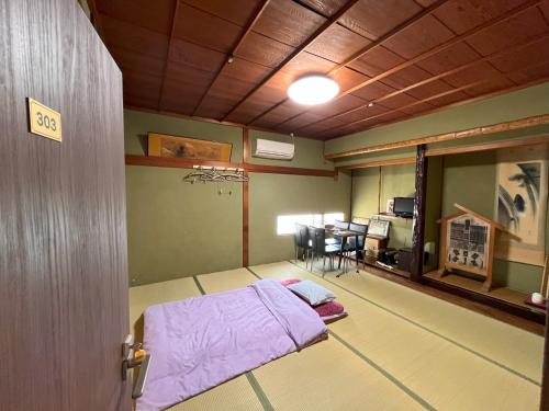 Postel nebo postele na pokoji v ubytování Guesthouse Hikari