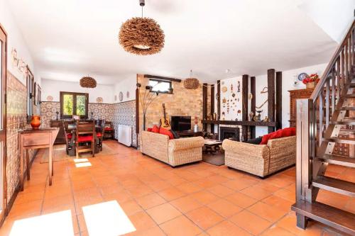 a living room filled with furniture and a fireplace at Gerês Mountain Lake Views by Gerês Casas in Geres