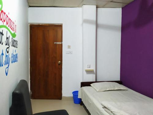 Una cama o camas en una habitación de Hotel Mohsin Plaza