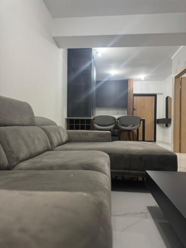 a living room with a couch and a table at Royal Apartments in Skopje
