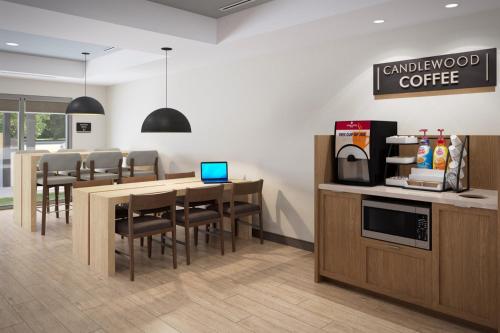 a kitchen and dining room with a table and chairs at Candlewood Suites Billings West by IHG in Billings