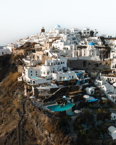 an aerial view of a village with white buildings at Honeymoon Petra Villas in Imerovigli