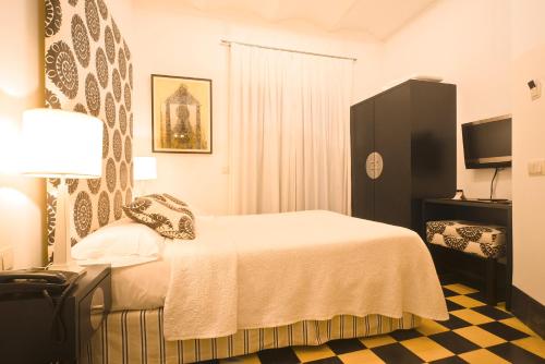 Кровать или кровати в номере Hostal Casa Alborada
