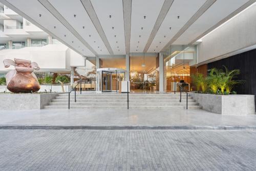 a lobby of a building with a statue of a woman at King Solomon by Isrotel Collection in Eilat