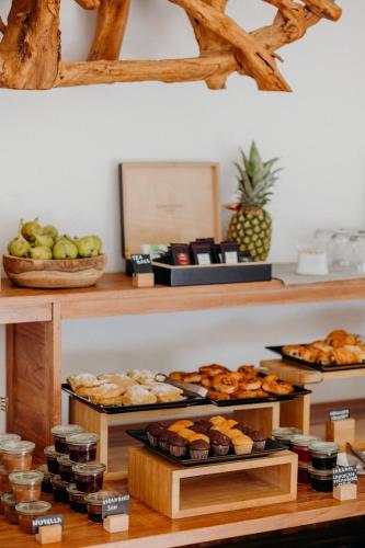 a bakery with different types of pastries on display at Honeymoon Petra Villas in Imerovigli