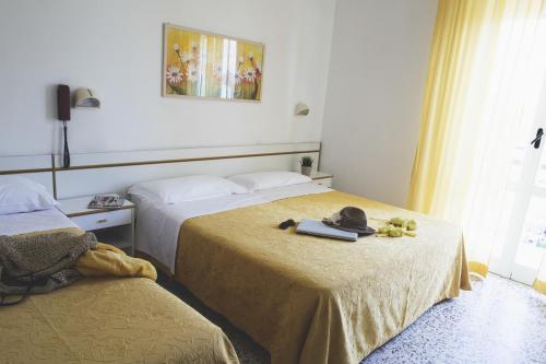 Кровать или кровати в номере Hotel Reyt