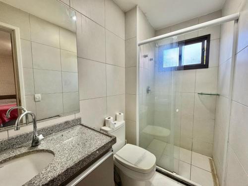 a bathroom with a shower and a toilet and a sink at VG SUN CUMBUCO 2 quartos - B2, apto 205 in Cumbuco