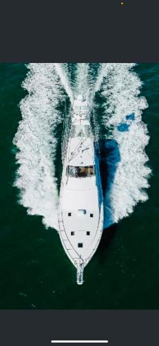 a boat in the middle of the water at Keys Livin - Yacht Rental in Key West