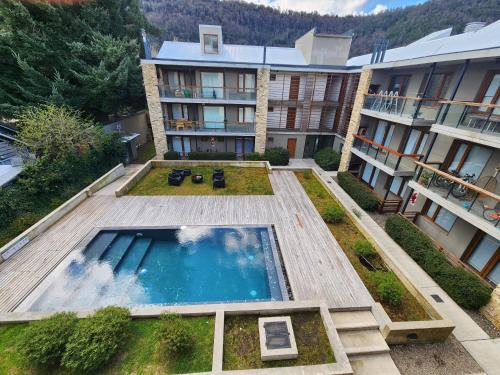 an aerial view of a hotel with a swimming pool at Álamos de los Andes - Andarlibre in San Martín de los Andes