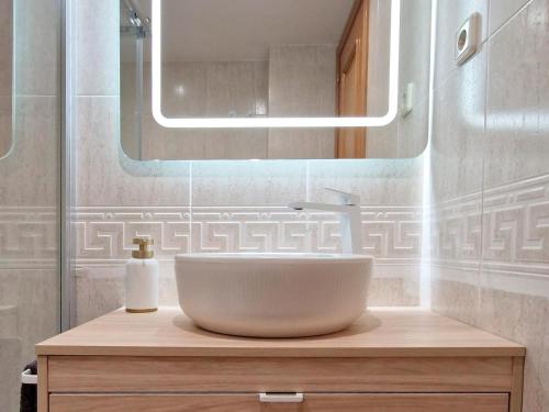 a bathroom with a sink and a mirror at Villmor - B53 - Coma De Albá, 1º in Benasque