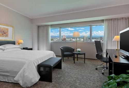 Quinto Centenario Hotelにあるベッド