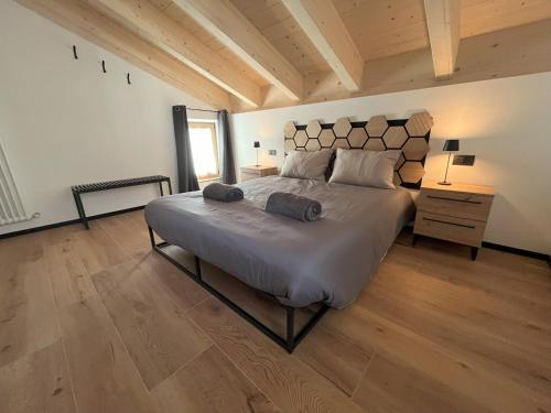 En eller flere senge i et værelse på Dolomiti Lake View Apartments