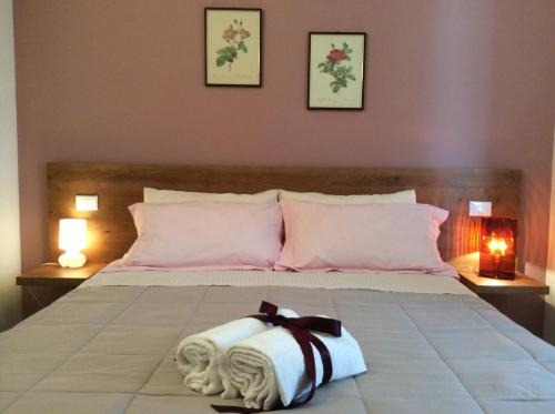 Un pat sau paturi într-o cameră la La Veranda Sul Giardino