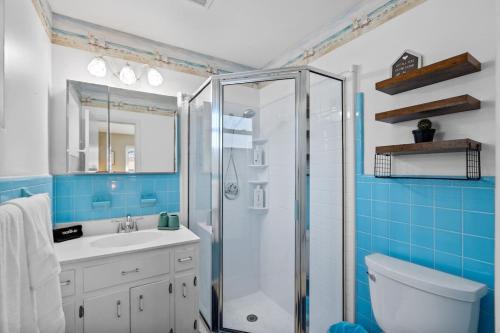 a bathroom with a shower and a sink and a toilet at Walk to Beach Indoor-Outdoor Living w Pool in Boca Raton