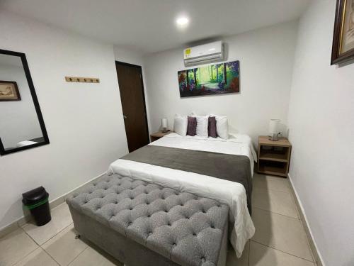 Ένα ή περισσότερα κρεβάτια σε δωμάτιο στο Aguacatala Hotel Boutique
