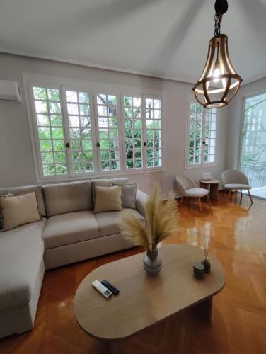 a living room with a couch and a table at Kolonaki 2 bedroom Flat in Athens