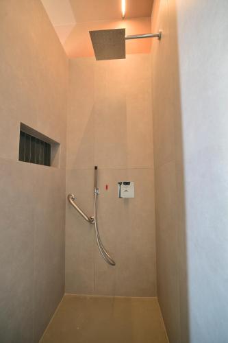 a bathroom with a shower with a shower head at Locanda Parsifal in Parma