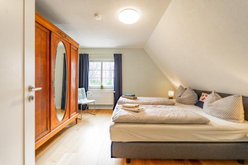 Postel nebo postele na pokoji v ubytování Forsthaus Wohnung 2 4 PAX Kamin & Balkon