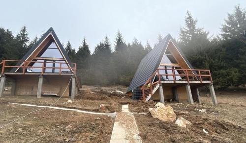 a home being constructed with two pointed roofs at AA Frame Retreat Fundata in Fundata