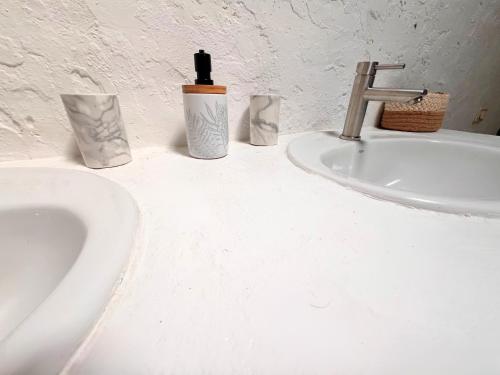 a bathroom counter with a sink and a faucet at Casa Gatti - Autentica Casa Canaria nel cuore di Lanzarote in Tiagua