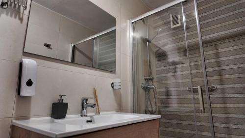 a bathroom with a sink and a shower at Apartalux Sublime Plus in Las Negras
