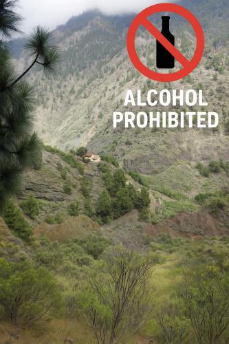 a sign that says alcohol prohibited on a mountain at Rivendell Eco lodge in El Paso