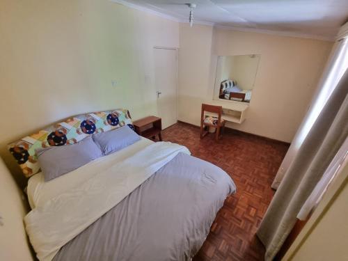 Ένα ή περισσότερα κρεβάτια σε δωμάτιο στο Leafy Expat Houseshare