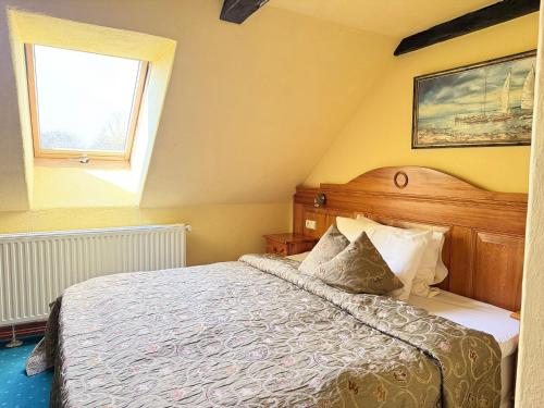 Ein Bett oder Betten in einem Zimmer der Unterkunft Gościniec Zamkowy