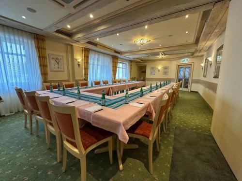 a large long table in a room with chairs at AR Boutique Hotel Mannheim in Mannheim
