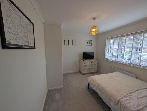 Ένα ή περισσότερα κρεβάτια σε δωμάτιο στο 3 Bed-Sleeps 5-Garden-Parking-Pets