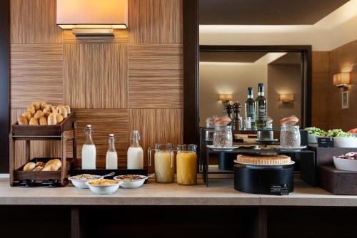 a counter with some food and drinks on it at Grand Hotel Adriatico in Florence