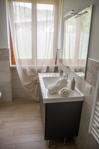 a bathroom with a sink and a mirror at Cà d'Nonu in Chiusa di Pesio