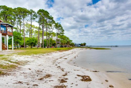 a beach in front of a house and the ocean at Beach and Dock Access Lanark Village Escape! in Lanark Village