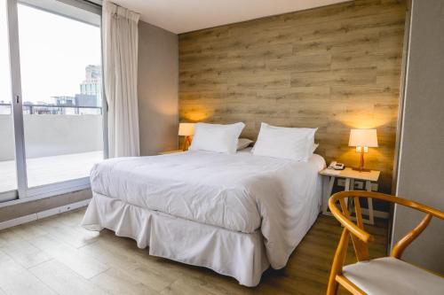 Postel nebo postele na pokoji v ubytování Smart Hotel Montevideo