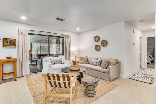 a living room with a couch and a table at Sunset on the Coast in Gulf Breeze