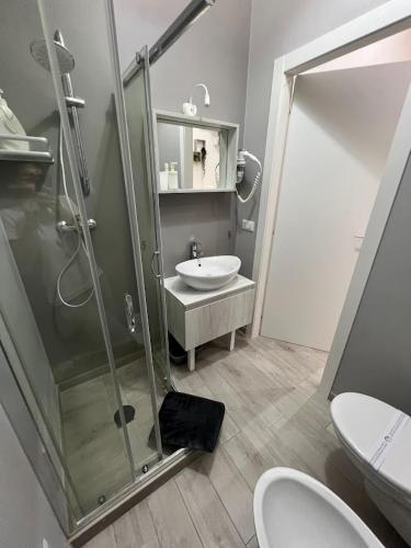 a bathroom with a glass shower and a sink at Radici Mare B&B in Torre dell'Orso