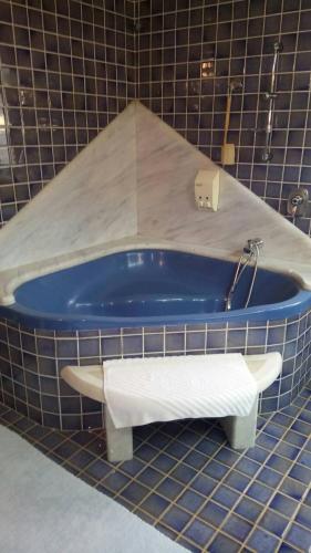 a blue tub with a towel in a bathroom at Fefe Apartment with Sea view in Vantačići