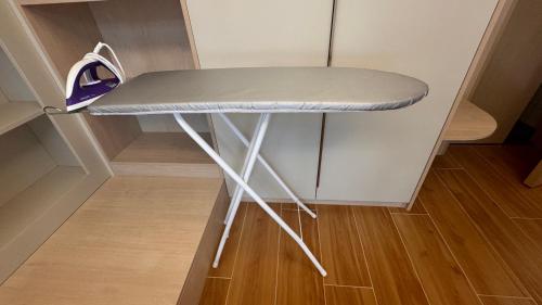 a desk in a small room with a table at Fantasea Condo Kamala beach 1BR apart B1 in Kamala Beach